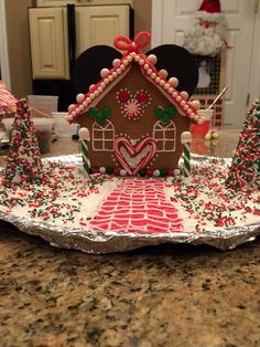 a gingerbread house decorated with icing and candy