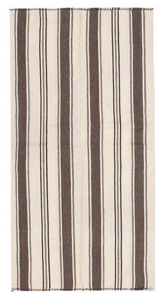 a brown and white striped rug on a white background