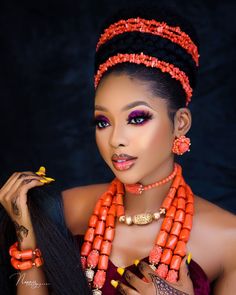 an african woman with bright makeup and jewelry