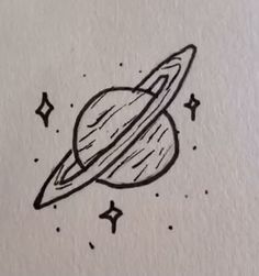 a drawing of the planet saturn with stars around it, on top of a piece of paper