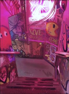 the interior of a room with graffiti all over it