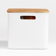 a white storage box with a wooden lid and an open window on the front side