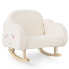 a white rocking chair with sheep faces on it's back and arms, sitting in front of a white background