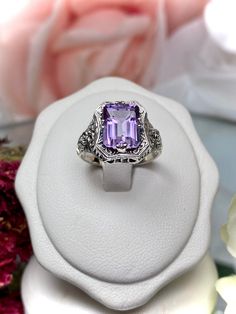 Natural Purple Amethyst Ring  Lovely Rectangle Design#148 Made To Order Make heads turn and stand out with this gorgeous piece of jewelry! This Edwardian reproduction filigree ring is made from sterling silver, and features an emerald cut high quality natural genuine purple amethyst gemstone measuring 9mm by 7mm (approximately 2.88 ct). From the beautiful intricate floral daisy design to the inside of the band marked 925 for sterling silver - this ring will take your look to the next level! Plus Luxury Sterling Silver Amethyst Birthstone Ring, Luxury Sterling Silver Amethyst Ring With Center Stone, Luxury Heirloom Amethyst Sterling Silver Ring, Luxury Heirloom Amethyst Ring In Sterling Silver, Luxury Lavender Amethyst Ring In Sterling Silver, Amethyst Mermaid Ring, Rectangular White Gold Ring With Accent Stones, Classic Amethyst Rectangular Ring For Anniversary, Classic Rectangular Amethyst Ring For Anniversary