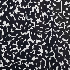 an abstract black and white painting with lots of small dots on it's surface