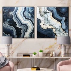 two paintings on the wall in a living room