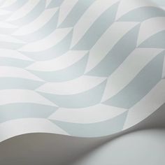 an abstract white and grey wallpaper with wavy lines in the center, on top of it