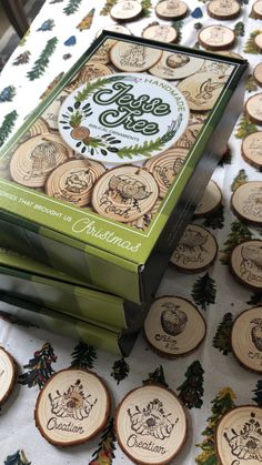 a table topped with lots of wooden slices covered in christmas decorations and words on them