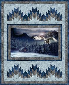 a quilt with an eagle flying in the sky above trees and snow covered mountains behind it