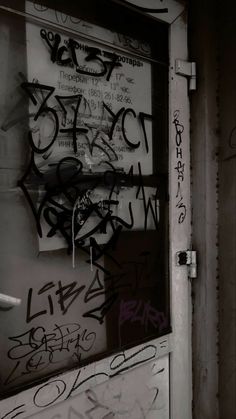 the door is covered with lots of graffiti