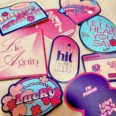 various stickers and magnets are on a table top with the words happy valentine's day written in different languages