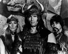 two men and a woman in costume standing next to each other with horns on their heads