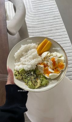 a person holding a plate with different types of food on it