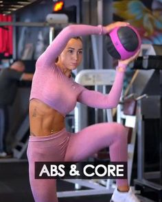 a woman doing squats with a medicine ball in her hand and the words abs & core above it