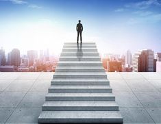 a man standing at the top of some stairs