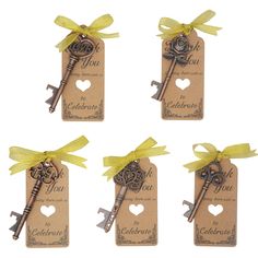 four key tags with yellow ribbon tied around them and the words i love you written on them