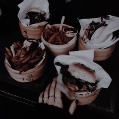 several baskets filled with food sitting on top of a table