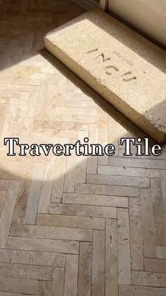 a tile floor with the words travertime tile on it and an image of a door