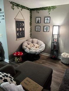 a living room filled with furniture and pictures on the wall