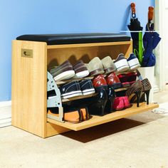 a wooden shoe rack filled with lots of shoes