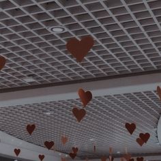 the ceiling is decorated with hearts and streamers for valentine's day decorations,