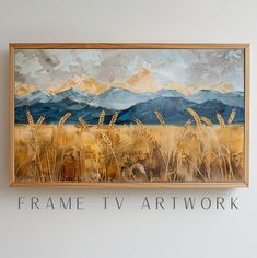 a painting hanging on the wall above a sign that says frame tv art work in front of a wheat field