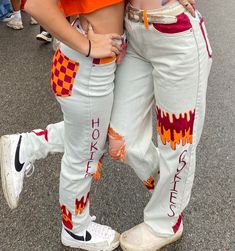 100% Customizable Gameday Jeans!! (Or for any special occasion) I would ask that you send me the pair of jeans you would want to be painted. Painted with acrylic and fabric paint. Will be shipped within 1-2 weeks. Trendy Hand Painted Cotton Jeans, Painted Overalls School Spirit, Senior Jeans Painted 2025, Graduation Jeans, Homecoming Jeans Decorated, Homecoming Jeans Painted, Hoco Pants Ideas, Painted Jeans School Spirit, Hoco Jeans Painted