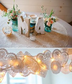 the table is decorated with flowers and lights