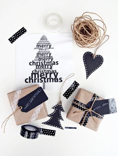 some wrapping paper and other items on a white table with black and white polka dots