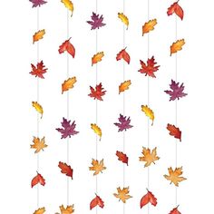 fall leaves hanging from strings on a white background