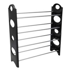 the rack is holding four pairs of black and white racks with holes on each side