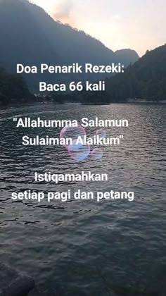 an image of the water with mountains in the background and text that reads, doa penark rezeki baca 6 kali