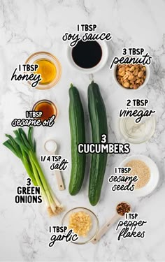 the ingredients for cucumbers on a marble counter top