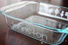 a glass casserole dish sitting on top of a wooden table