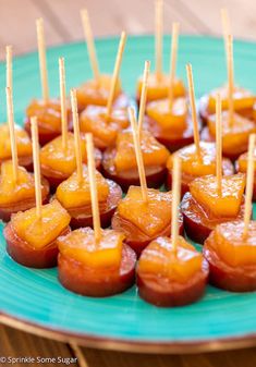 small appetizers with toothpicks on a blue plate