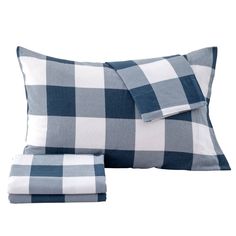 two blue and white checkered pillows on top of each other, one is folded