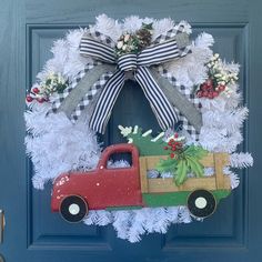 a christmas wreath with a red truck on it