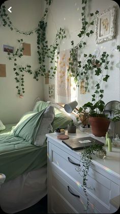 the bedroom is decorated with plants and pictures