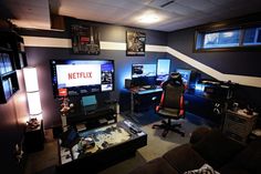 a room filled with lots of computer monitors and desks