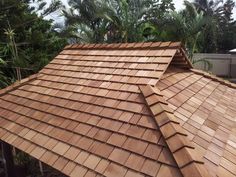 the roof of a house with wooden shingles