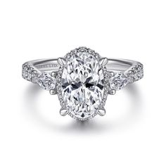 an oval cut engagement ring with diamond accents