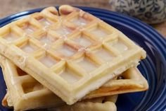 three waffles stacked on top of each other on a blue plate