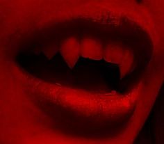 a woman's mouth with red light coming from it