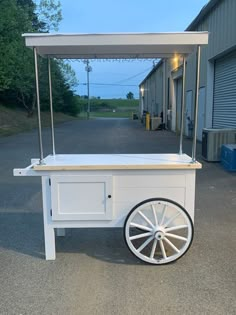 an ice cream cart sitting in front of a building