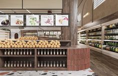 the produce section of a grocery store with lots of food