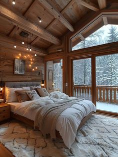 a large bed sitting in the middle of a bedroom next to a wooden wall and ceiling