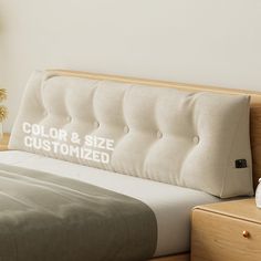 a bed with a pillow that says, color and size customized on the side