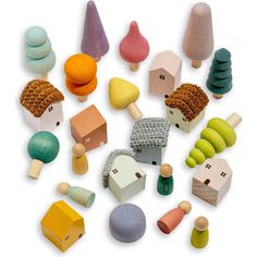 various wooden toys are arranged on a white surface