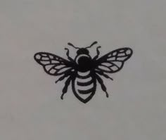 a black and white photo of a bee on a white sheet with the words honey written in it