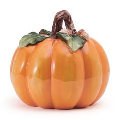 an orange pumpkin with green leaves on it's top and bottom part, sitting in front of a white background